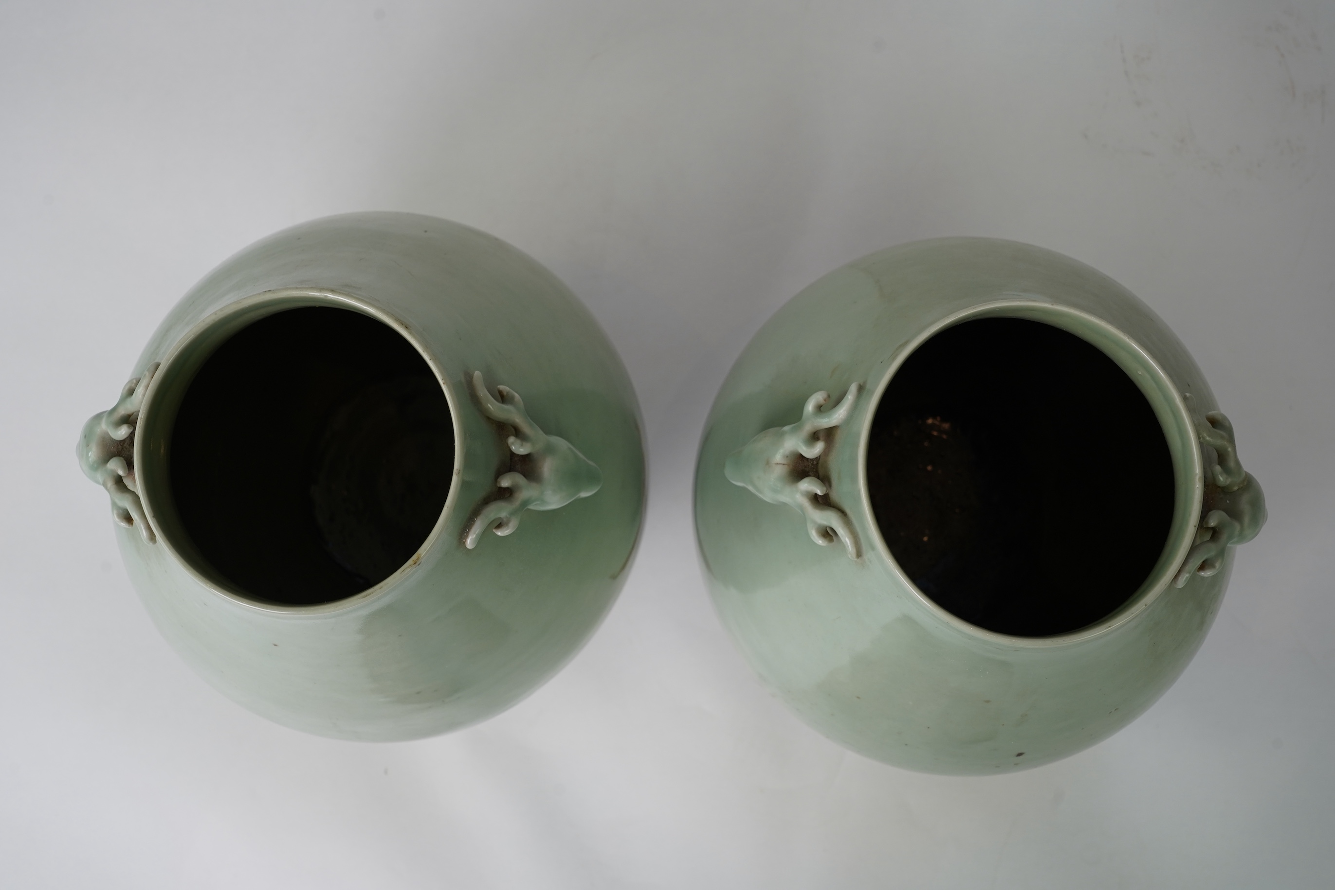 A pair of large Chinese celadon glazed ‘ hu’ vases, Yongzheng seal mark, 19th century